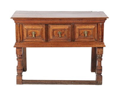 Lot 431 - <> A Late 17th Century Oak Dresser, the three-plank top above three geometric moulded drawers...