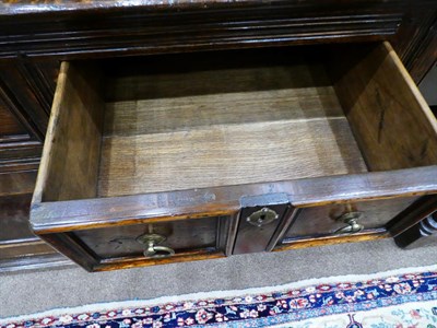 Lot 433 - David Semple: A Reproduction Oak Sideboard, in 17th century style, the moulded top above four...