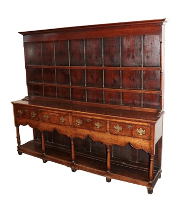 Lot 434 - A George III Oak Dresser and Rack, late 18th century, the bold cornice above two shelves, the...