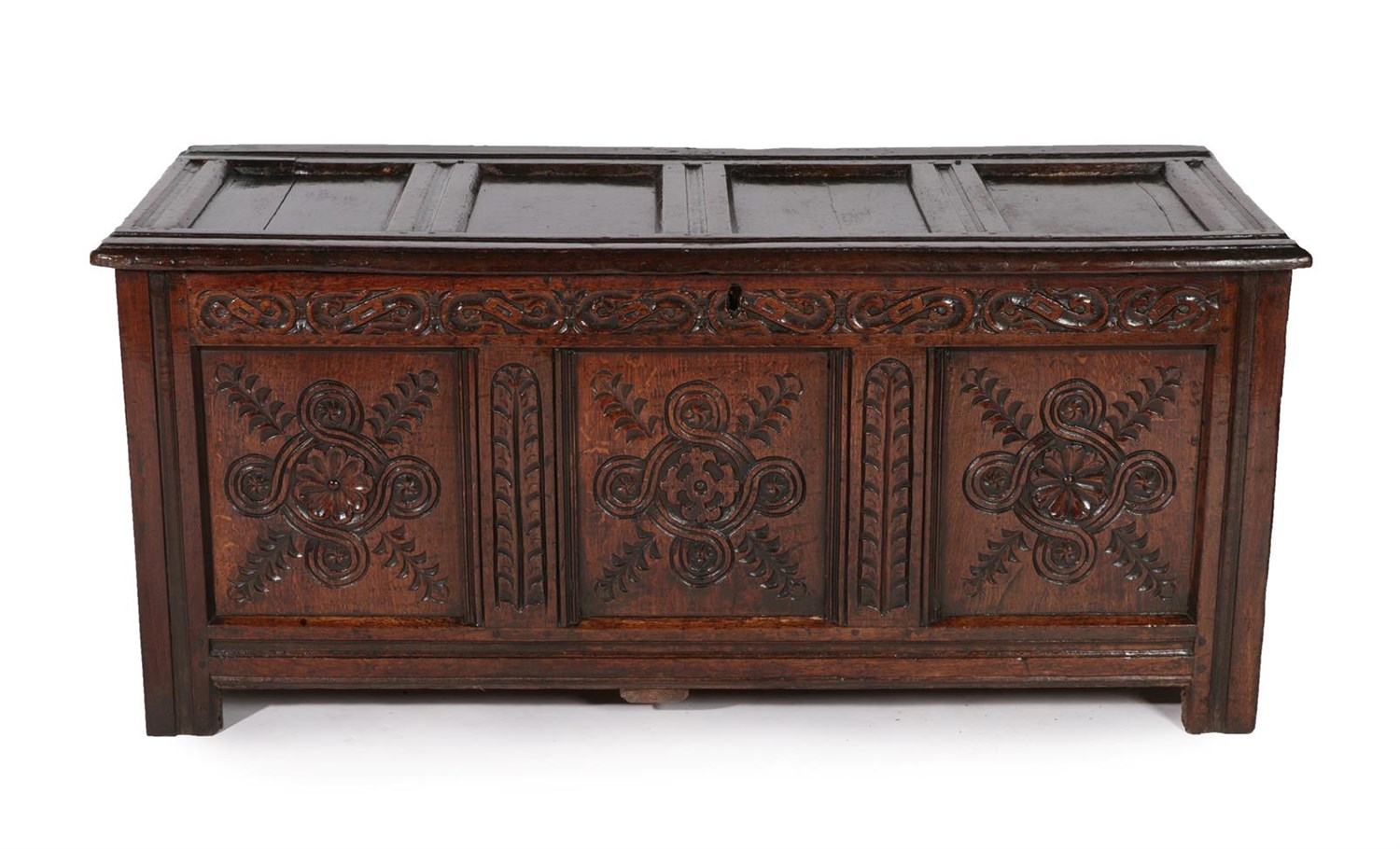 Lot 440 - A Late 17th Century Joined Oak Chest, the hinged lid with four moulded panels above a carved frieze
