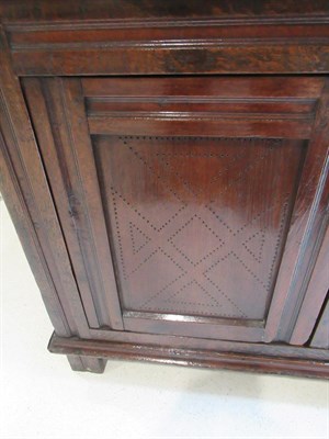 Lot 441 - An 18th Century Joined Oak Food Cupboard, probably North Wales, the upper section with turned...