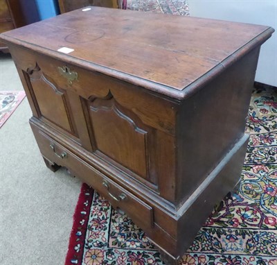 Lot 446 - An 18th Century Joined Oak Chest, the hinged lid enclosing a vacant interior above two moulded...