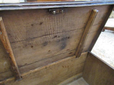 Lot 446 - An 18th Century Joined Oak Chest, the hinged lid enclosing a vacant interior above two moulded...