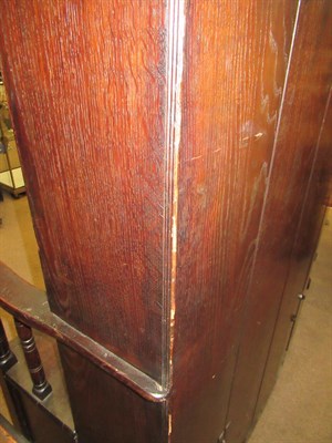 Lot 453 - A 20th Century Joined Oak Settle, of boarded construction, the curved back section above a...