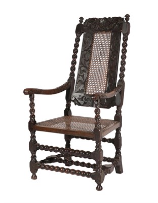 Lot 458 - ^ A Late 17th Century Carved Walnut Open Armchair, with cane back and seat, the carved top rail...