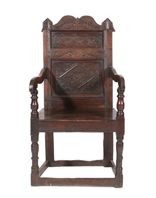 Lot 461 - A Late 17th Century Joined Oak Wainscot Armchair, with a leaf carved top rail above moulded...