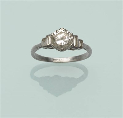 Lot 514 - An Art Deco Diamond Solitaire Ring, the round brilliant cut diamond with graduated pairs of...