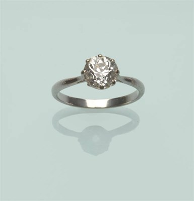 Lot 515 - A Diamond Solitaire Ring, the old cut diamond in a white eight claw setting to a tapered...