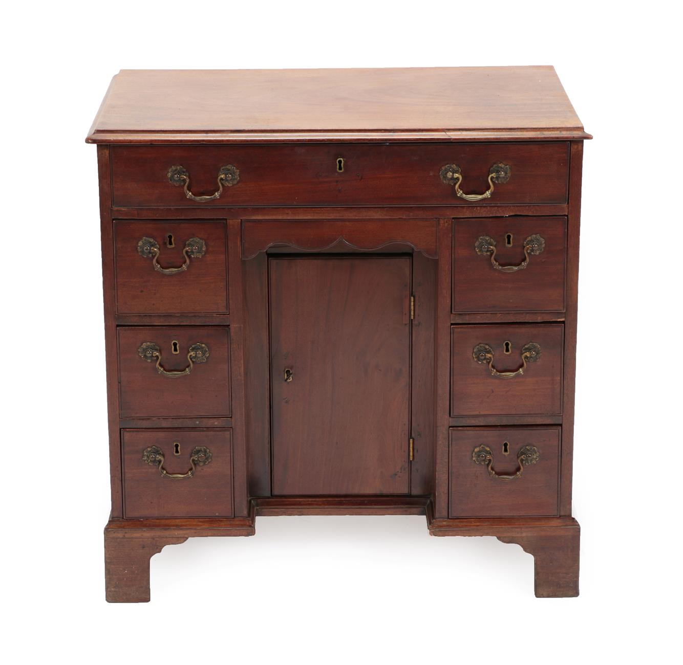 Lot 481 - A George III Mahogany Kneehole Dressing Table, late 18th century, the moulded top above a long...