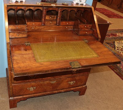 Lot 485 - A George I Walnut, Crossbanded and Barber Pole Strung Bureau, early 18th century, the...