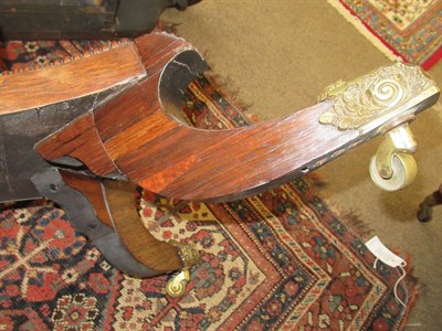 Lot 492 - <> A Regency Rosewood Sofa Table, early 19th century, with two rounded drop leaves above two...
