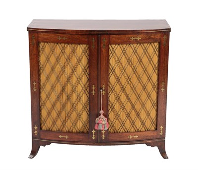 Lot 527 - A Regency Rosewood and Brass Inlaid Side Cabinet, early 19th century, of bowfront form, the...