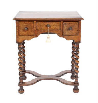 Lot 530 - A William & Mary Style Figured Walnut and Crossbanded Side Table, with three small drawers above an