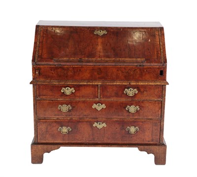 Lot 547 - A George I Walnut and Featherbanded Bureau, early 18th century, the moulded fall with a rest...