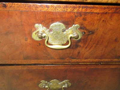 Lot 547 - A George I Walnut and Featherbanded Bureau, early 18th century, the moulded fall with a rest...