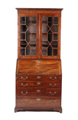 Lot 555 - ~ A George III Mahogany Bureau Bookcase, late 18th century, the dentil cornice above astragal...