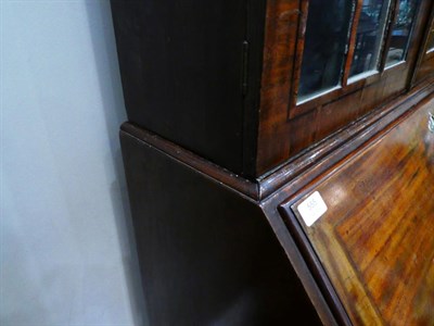 Lot 555 - ~ A George III Mahogany Bureau Bookcase, late 18th century, the dentil cornice above astragal...