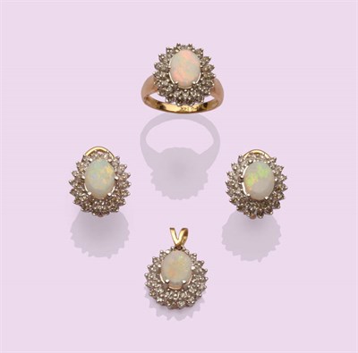 Lot 526 - A Suite of Opal and Diamond Cluster Jewellery, each oval cabochon opal within a double border...