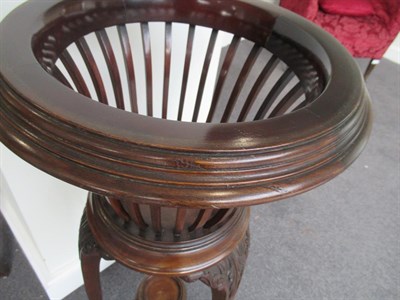 Lot 596 - An Edwardian Mahogany Planter, the circular moulded rim enclosing a removable brass liner above...
