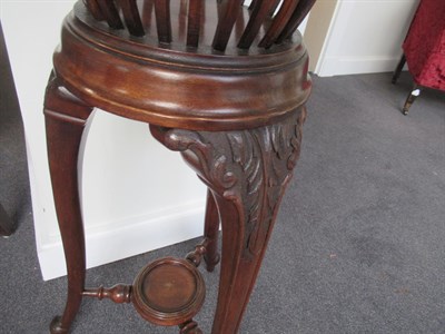 Lot 596 - An Edwardian Mahogany Planter, the circular moulded rim enclosing a removable brass liner above...