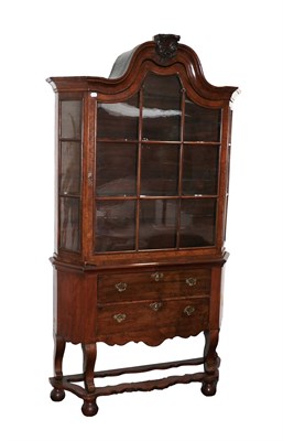 Lot 608 - A Dutch Walnut Display Cabinet, in 17th century style, the moulded top above glazed doors enclosing