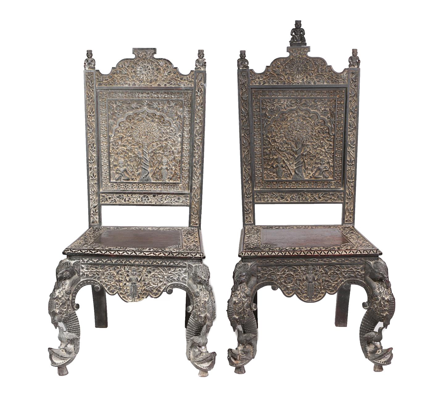 Lot 611 - A Pair of Late 19th Century Burmese Rosewood Hall Chairs, profusely carved with foliage and...