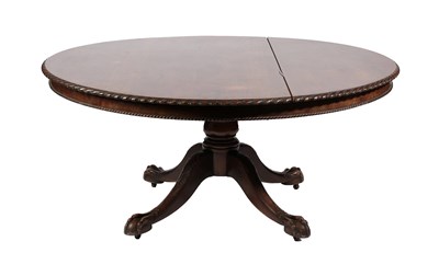 Lot 620 - ~ A Late 19th Century Carved Mahogany Circular Dining Table, the fliptop with carved and...