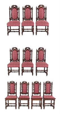 Lot 628 - Ten Victorian Carved Oak Dining Chairs, circa 1880, recovered in pink floral fabric, comprising six