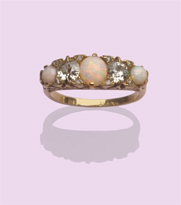 Lot 531 - An Opal and Diamond Five Stone Ring, three cabochon opals alternate with two old brilliant cut...