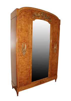 Lot 636 - A French Art Deco Burr Ash, Marquetry and Gilt Metal Mounted Wardrobe, early 20th century, of domed