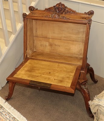 Lot 644 - A Late 19th Century French Carved Walnut Folio Stand, with acanthus and scrolled pediment...
