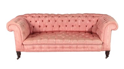 Lot 656 - A Victorian Chesterfield Drop-End Sofa, circa 1870, recovered in buttoned pink silk damask,...