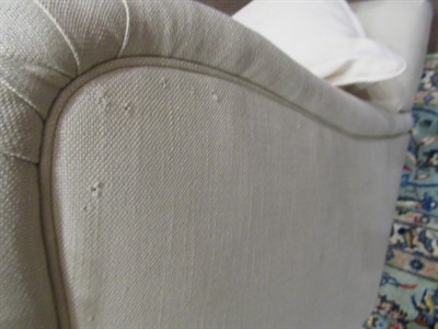 Lot 657 - ~ A Pair of Feather-Filled Three-Seater Sofas, modern, covered in cream calico-type fabric,...