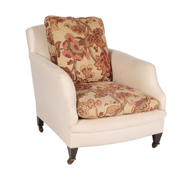 Lot 662 - ~ A Howard Style Armchair, late 19th/early 20th century, covered in cream calico, the rear leg...