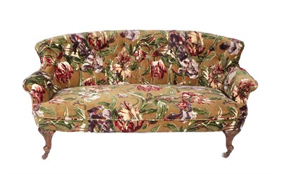 Lot 667 - A Victorian Two-Seater Sofa, late 19th century, recovered in floral fabric, with curved and...