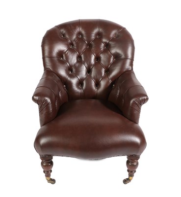 Lot 671 - A Victorian Armchair, late 19th century, recovered in brown buttoned leather, with rounded arms and