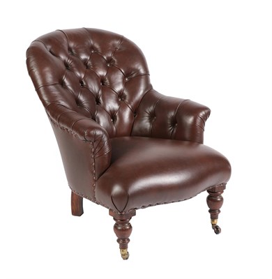 Lot 671 - A Victorian Armchair, late 19th century, recovered in brown buttoned leather, with rounded arms and