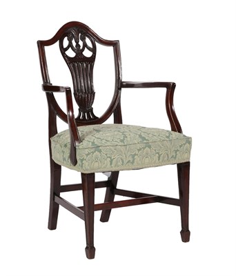 Lot 672 - <> A 19th Century Mahogany Hepplewhite Style Armchair, recovered in green floral fabric, the...