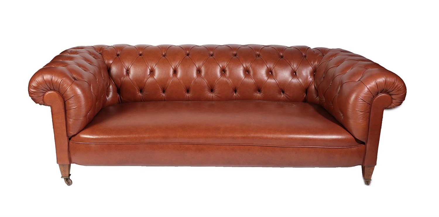 Lot 676 - A Victorian Chesterfield Sofa, late 19th century, recovered in buttoned brown leather with...