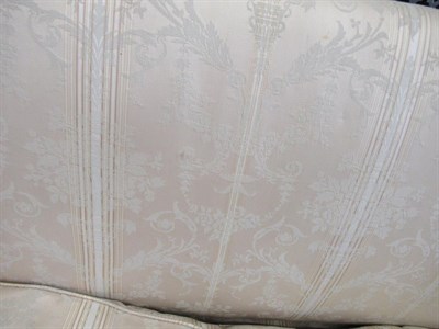 Lot 691 - A George III Three-Seater Sofa, late 18th century, recovered in floral striped silk fabric, the...