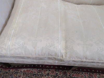 Lot 691 - A George III Three-Seater Sofa, late 18th century, recovered in floral striped silk fabric, the...
