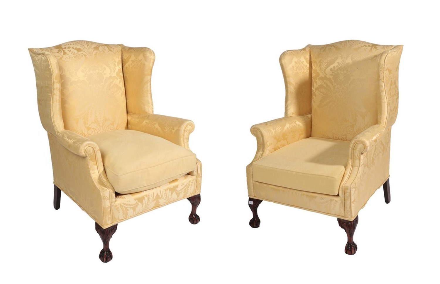 Lot 692 - A Pair of George III Style Wing-Back Armchairs, 20th century, recovered in yellow silk damask, with