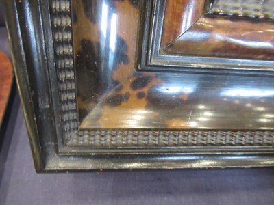 Lot 693 - A Late 19th Century Flemish Style Tortoiseshell and Ebonised Wall Mirror, the bevelled glass...