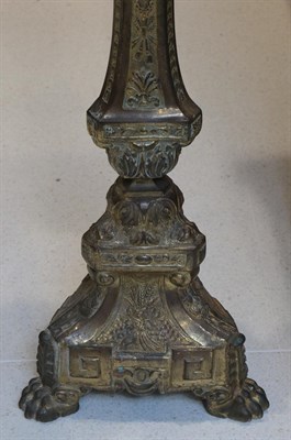 Lot 696 - ^ A Pair of Gilt Metal Altar Candlesticks, late 19th/early 20th century, each with shaped...