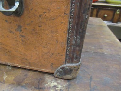 Lot 700 - An Early 20th Century Louis Vuitton Steamer Trunk, covered in original close-nailed brown...