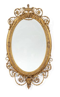 Lot 713 - A Gilt and Gesso Oval Mirror, in Adam style, the oval bevelled glass plate within a moulded...