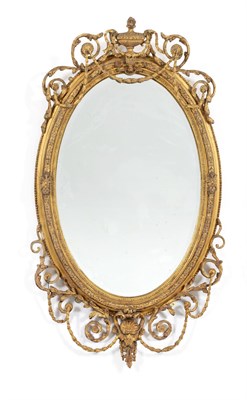 Lot 715 - A Victorian Gilt and Gesso Oval Mirror, in Adam style, the oval bevelled glass plate within a...