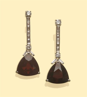 Lot 553 - A Pair of 18 Carat White Gold Garnet and Diamond Drop Earrings, round brilliant cut and...