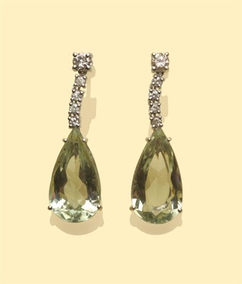 Lot 554 - A Pair of Green Quartz and Diamond Earrings, round brilliant cut diamonds suspend a pear cut...