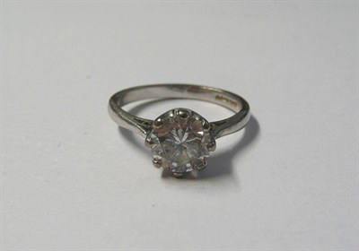 Lot 556 - A Platinum Diamond Solitaire Ring, a round brilliant cut diamond, in an eight claw setting to a...